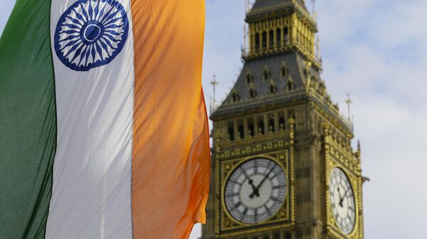 An Indian Flag hangs near  the London landmark Big Ben in Parliament Square in London, Thursday, Nov. 12, 2015. - Sputnik India