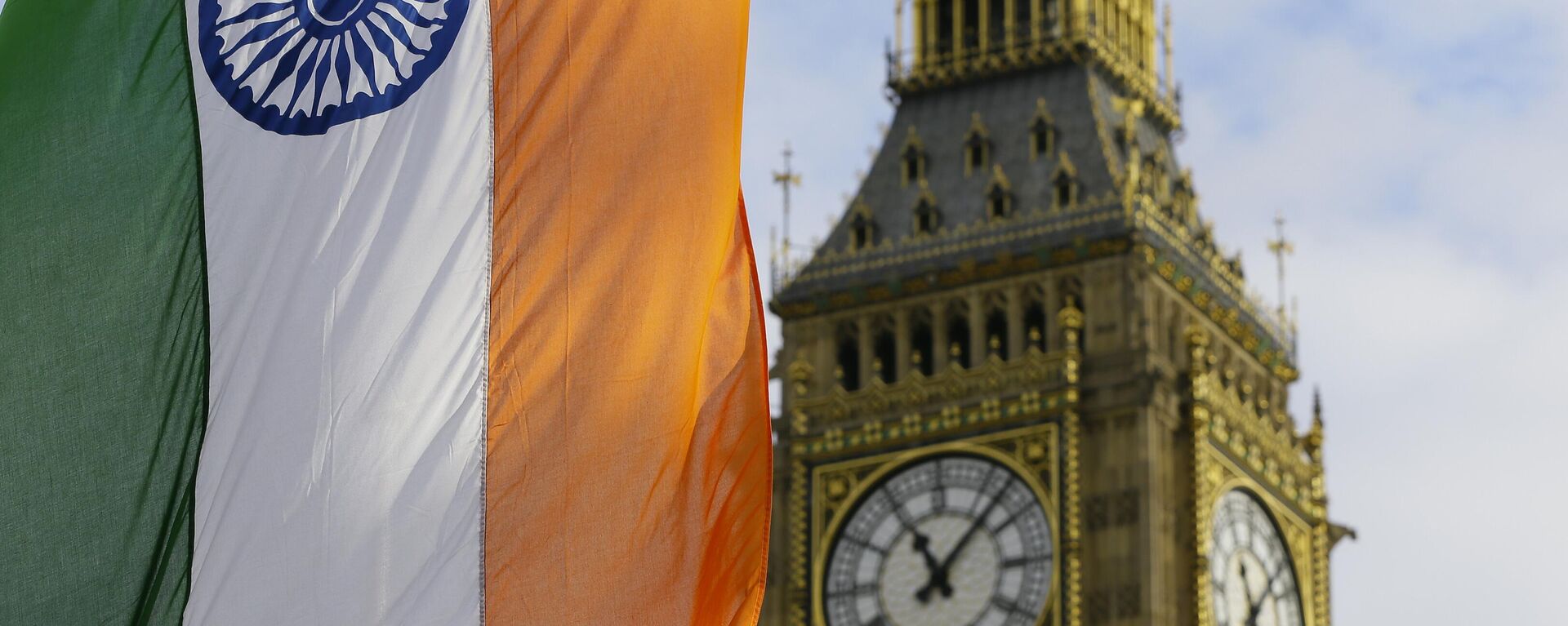 An Indian Flag hangs near  the London landmark Big Ben in Parliament Square in London, Thursday, Nov. 12, 2015. - Sputnik India, 1920, 29.01.2023