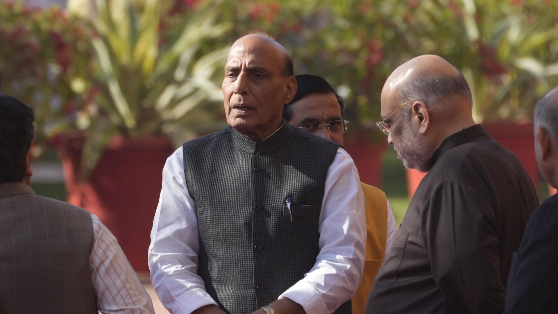 Indian Defence Minister Rajnath Singh, center, and Home Minister Amit Shah, right, talk to their cabinet colleagues as they wait to pay respect to the victims of 2001 terror attack on Parliament House, in New Delhi, Tuesday, Dec. 13, 2022. - Sputnik India, 1920, 14.02.2023