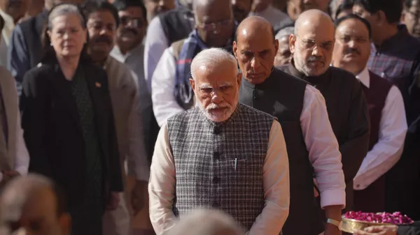 Indian Prime Minister Narendra Modi with his cabinet colleagues and other political leaders stand in a queue to offer floral tributes to the victims of 2001 terror attack on Parliament House, in New Delhi, Tuesday, Dec. 13, 2022. - Sputnik India