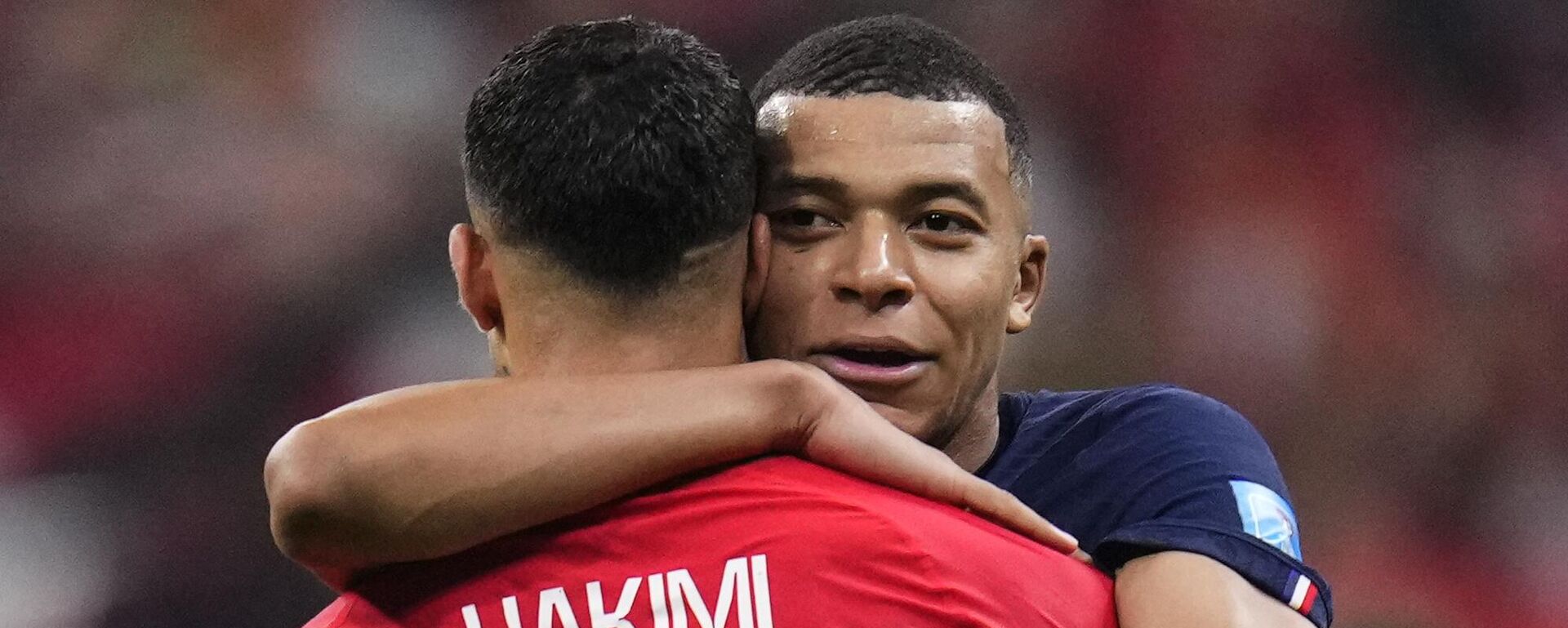 France's Kylian Mbappe hugs Morocco's Achraf Hakimi at the end of the World Cup semifinal soccer match between France and Morocco at the Al Bayt Stadium in Al Khor, Qatar, Wednesday, Dec. 14, 2022. - Sputnik India, 1920, 15.12.2022