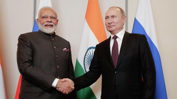 India's Prime Minister Narendra Modi, left, shakes hands with Russia's President Vladimir Putin (File) - Sputnik India
