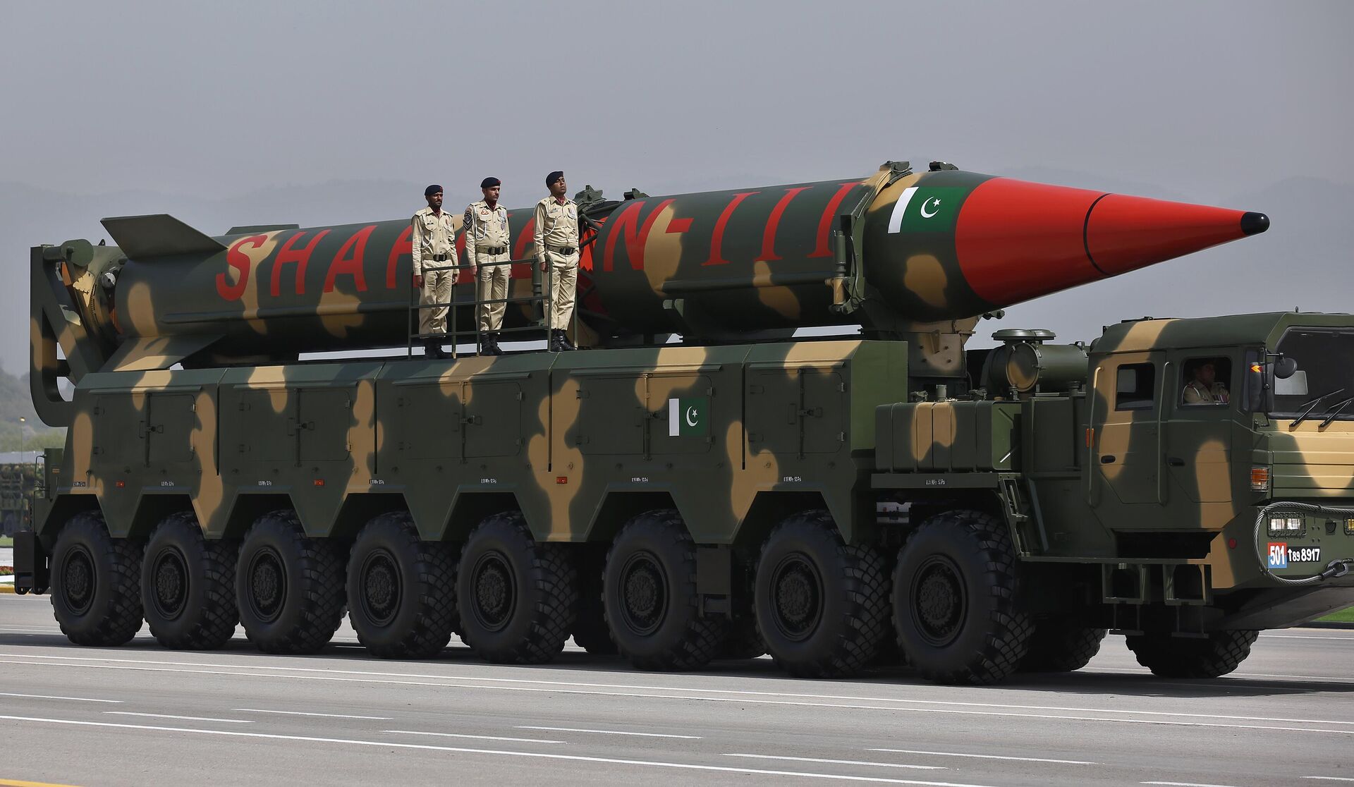 A Pakistani-made Shaheen-III missile, that is capable of carrying nuclear warheads, is carried on a trailer during a military parade in connection with Pakistan National Day celebrations, in Islamabad, Pakistan, Thursday, March 25, 2021. - Sputnik India, 1920, 03.01.2023