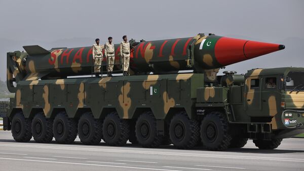A Pakistani-made Shaheen-III missile, that is capable of carrying nuclear warheads, is carried on a trailer during a military parade in connection with Pakistan National Day celebrations, in Islamabad, Pakistan, Thursday, March 25, 2021. - Sputnik India