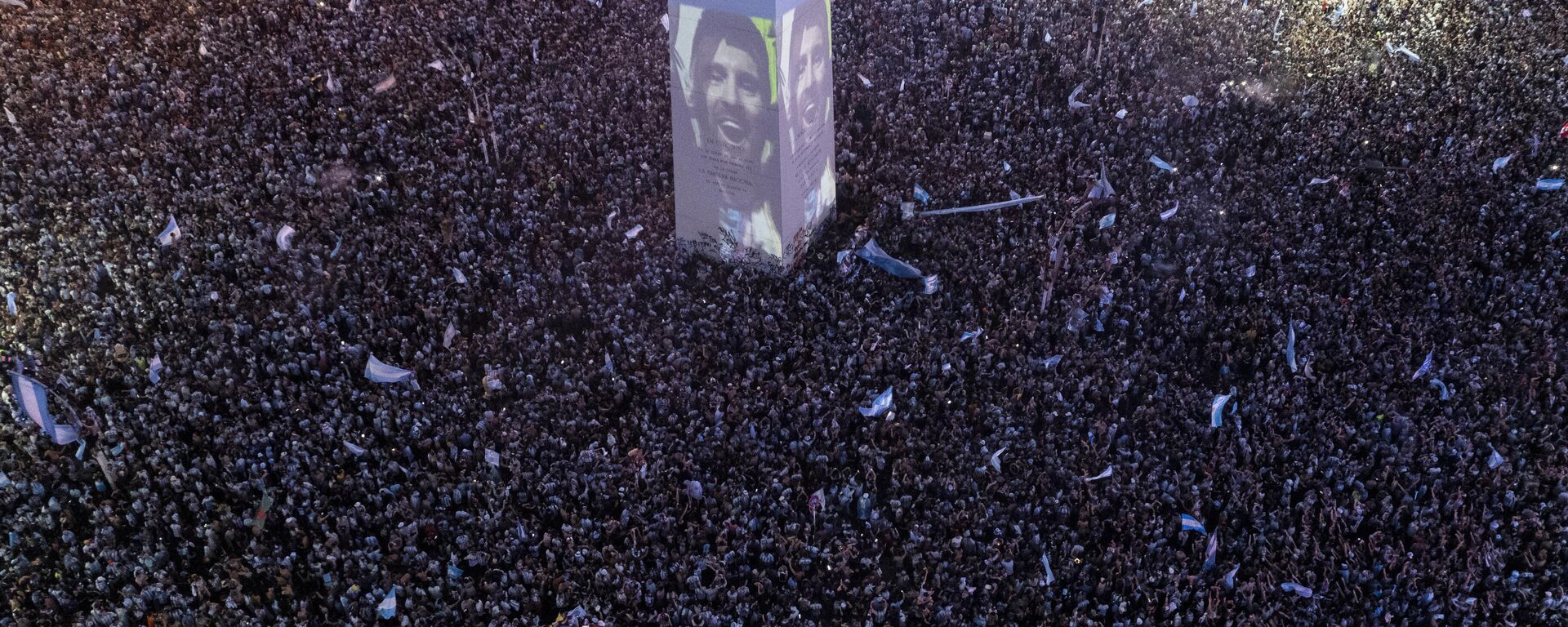 Tha face of Argentina's striker Lionel Messi is projected on the capital's Obelisk as fans celebrate their team's World Cup victory over France in Buenos Aires, Argentina, Sunday, Dec. 18, 2022. - Sputnik India, 1920, 19.12.2022