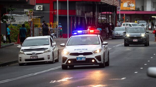 A police car drives along a street in Fiji's capital city Suva on December 22, 2022. - Sputnik India