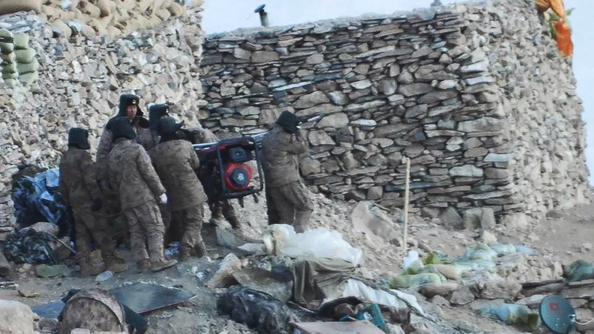 This undated handout photograph released by the Indian Army on February  16, 2021 shows People Liberation Army (PLA) soldiers during military disengagement along the Line of Actual Control (LAC) at the India-China border in Ladakh
