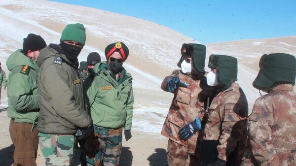 FILE-In this photograph provided by the Indian Army, army officers of India and China hold a meeting at Pangong lake region in Ladakh on the India-China border on Wednesday, Feb. 10, 2021 - Sputnik India