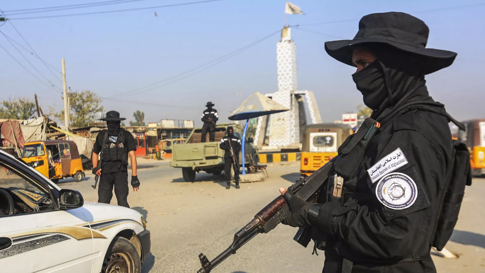 A member of the Taliban security forces stand guard at a checkpoint along a street in Jalalabad on December 6, 2022.
