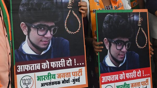 Bharatiya Janata Party (BJP) supporters shout slogans holding photos of muder accused Aftab Ameen Poonawala, demanding speedy justice in the murder case of Shraddha Walkar by her paramour Poonawala in Delhi earlier this year, during a protest in Mumbai on November 24, 2022. - Sputnik India