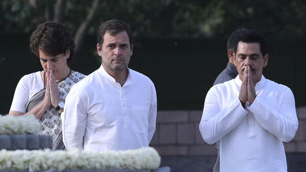 Congress Party former President Rahul Gandhi, center, looks as his sister and party General Secretary Priyanka Gandhi Vadra, left, and her husband Robert Vadra, as they pay homage to former Indian Prime Minister Rajiv Gandhi on his death anniversary in New Delhi, India, Tuesday, May 21, 2019. - Sputnik India