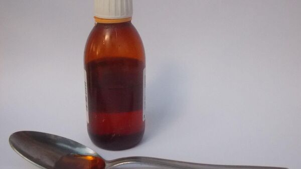 Cough syrup with tablespoon. - Sputnik India