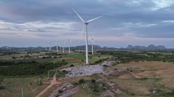 A windmill farm works in Anantapur district, Andhra Pradesh, India, Wednesday, Sept 14, 2022. - Sputnik भारत