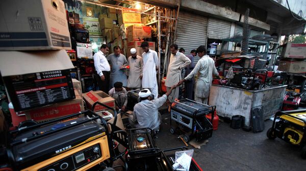 In this Tuesday, May 28, 2013 file photo, Pakistani customers buying and getting their generators, which are widely used due to long hours of power cuts, in Rawalpindi, Pakistan. - Sputnik India