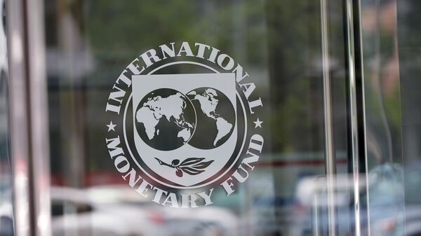 The seal of the International Monetary Fund is seen at the headquarters building in Washington, DC on July 5, 2015 - Sputnik भारत