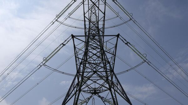 An electricity pylon in Lydd, southern England - Sputnik भारत