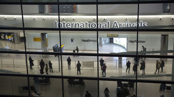 n this file photo dated Tuesday, Jan. 26, 2021, people in the arrivals area at Heathrow Airport in London, during England's coronavirus lockdown - Sputnik भारत