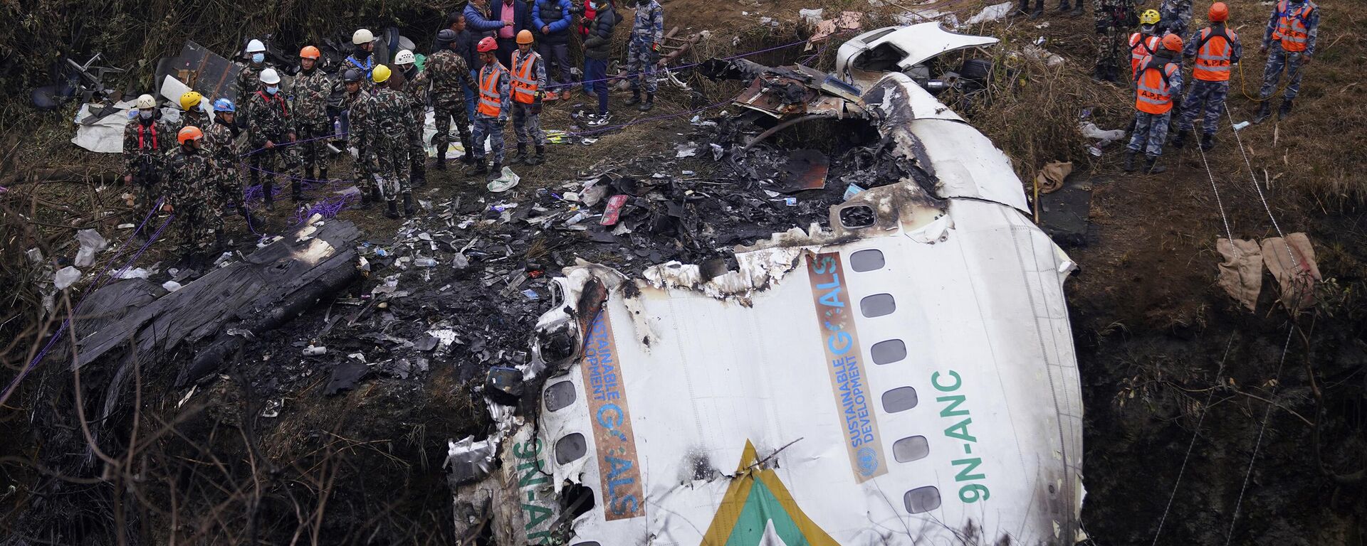 Rescuers scour the crash site in the wreckage of a passenger plane in Pokhara, Nepal, Monday, Jan.16, 2023. - Sputnik India, 1920, 16.01.2023