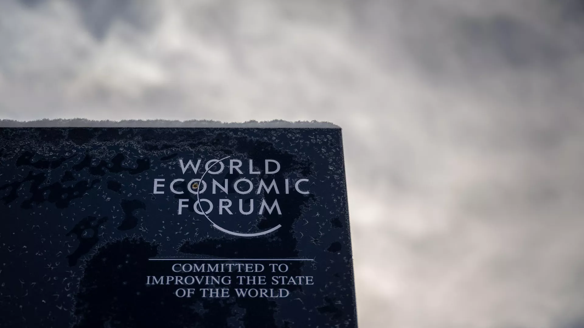 A photograph shows a sign of the World Economic Forum (WEF) in the alpine resort of Davos, on the opening day of the annual meeting in Davos on January 16, 2023.