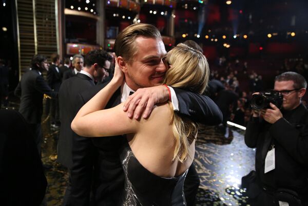 Leonardo DiCaprio, winner of the award for best actor in a leading role for The Revenant, left, embraces Kate Winslet backstage at the Oscars on Sunday, Feb. 28, 2016, at the Dolby Theatre in Los Angeles. - Sputnik India