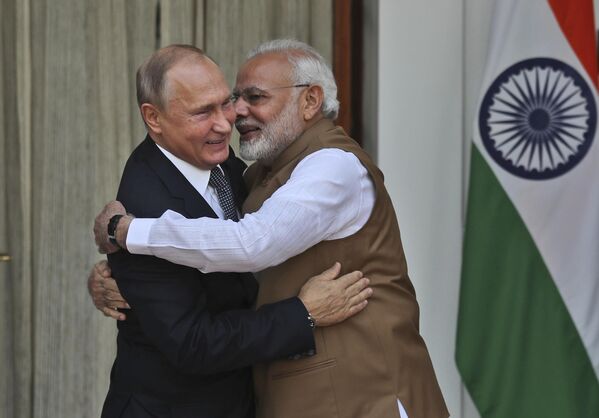 Indian Prime Minister Narendra Modi, right, hugs Russian President Vladimir Putin before their meeting in New Delhi, India, Friday, Oct. 5, 2018. Putin arrived in India on Thursday for a two-day visit during which India signed a $5 billion deal to buy Russian S-400 air defense systems despite a U.S. law ordering sanctions on any country trading with Russia&#x27;s defense and intelligence sectors. (AP Photo/Manish Swarup) - Sputnik India