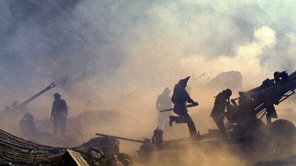 In this July 10, 1999 file photo, Indian artillery guns are engulfed in smoke in Dras, some 155 kilometers (96 miles)  north of Srinagar, India as Indian troops fight Pakistani intruders in the disputed Kashmir. - Sputnik भारत