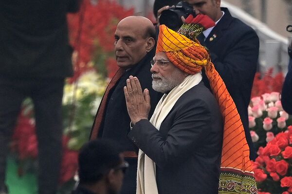 Indian Prime Minister Narendra Modi (R) gestures next to India&#x27;s Minister of Defence Rajnath Singh as they arrive to attend India&#x27;s 74th Republic Day parade in New Delhi on January 26, 2023. (Photo by Money SHARMA / AFP) - Sputnik India
