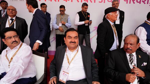 Industrialist Gautam Adani, center, sits for a group photograph during the Ground Breaking Ceremony @3.0 of the UP Investors Summit Lucknow in the northern Indian state of Uttar Pradesh, India, Friday, June 3, 2022. - Sputnik भारत
