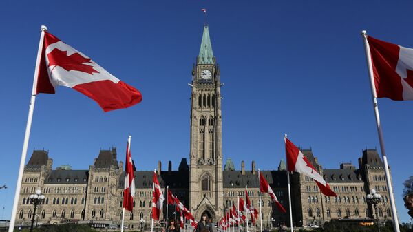 Canadian flags line the walkway in front of the Parliament in Ottawa, Ontario, October 2, 2017 - Sputnik India