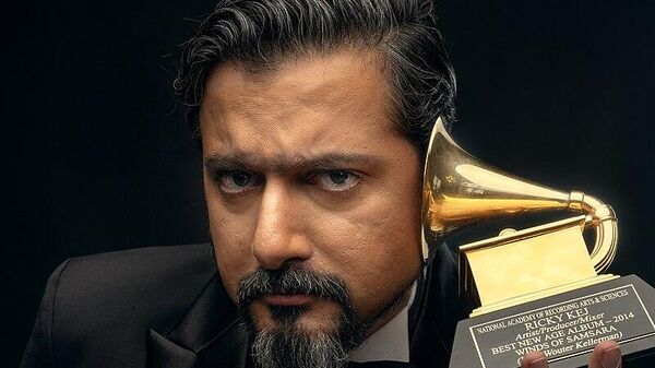 Ricky Kej with his Grammy trophies - Sputnik India