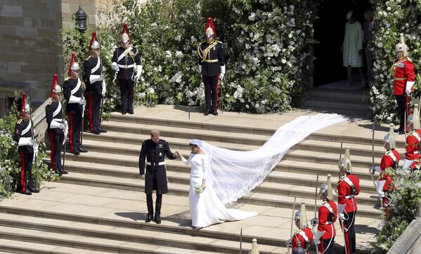 Britain's Prince Harry and Meghan Markle leave after their wedding ceremony at St. George's Chapel in Windsor Castle in Windsor, near London, England, Saturday, May 19, 2018. - Sputnik India