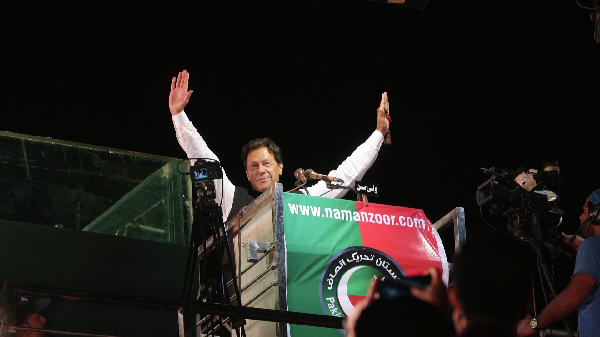 Former Pakistani Prime Minister Imran Khan waves to his supporters during an anti government rally, in Lahore, Pakistan, Thursday, April 21, 2022. - Sputnik India, 1920, 11.02.2023