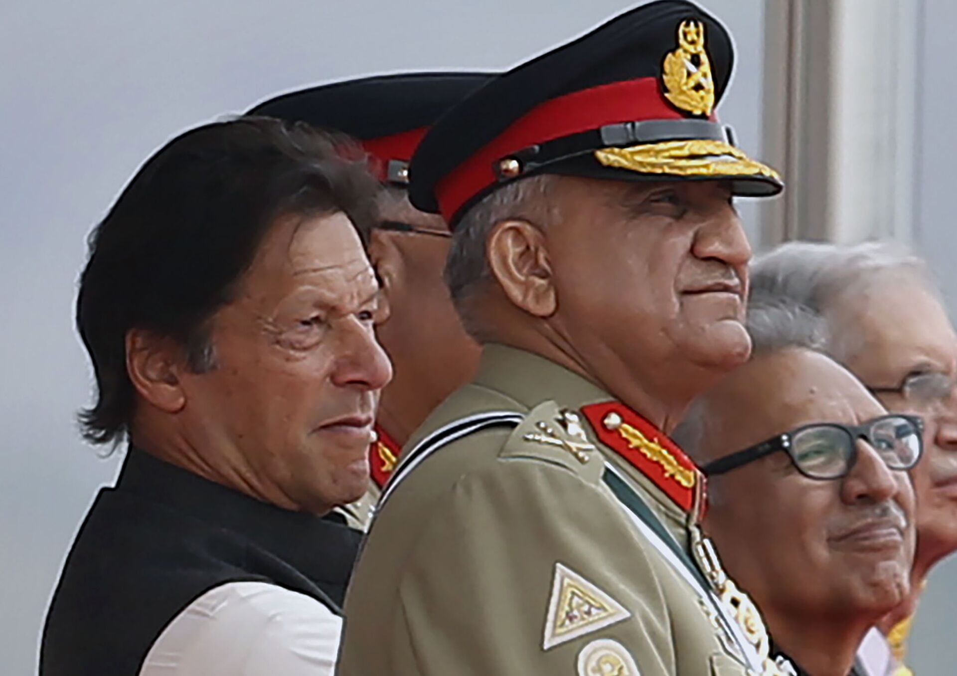 In this March 23, 2019 photo, Pakistan's Army Chief Gen. Qamar Javed Bajwa, center, watches a parade with Prime Minister Imran Khan, left, and President Arif Alvi, in Islamabad, Pakistan.  - Sputnik India, 1920, 11.02.2023
