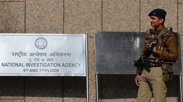 A Central Industrial Security Force guard stands outside the office of the National Investigation Agency (NIA) in New Delhi  - Sputnik India