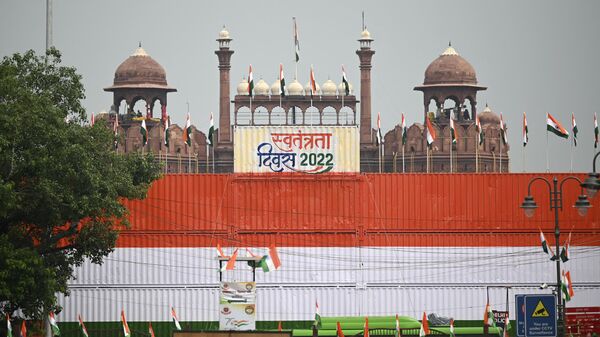 A view of the stacked containers in the guise of Indian national flag is pictured in front of the Red Fort on the eve of country's Independence Day celebrations in New Delhi on August 14, 2022. (Photo by Sajjad HUSSAIN / AFP) - Sputnik India