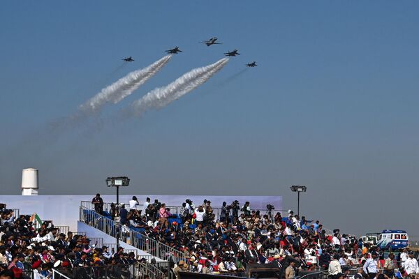 Indian Air Force (IAF) aircrafts fly past during the inaugural day of the 14th edition of 'Aero India 2023' airshow at the Yelahanka air force station in Bengaluru on February 13, 2023. - Sputnik India