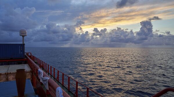Sun rises near the tiny atoll of Alphonse where scientists began exploring the depths of the Indian Ocean, Thursday March 7, 2019  - Sputnik भारत