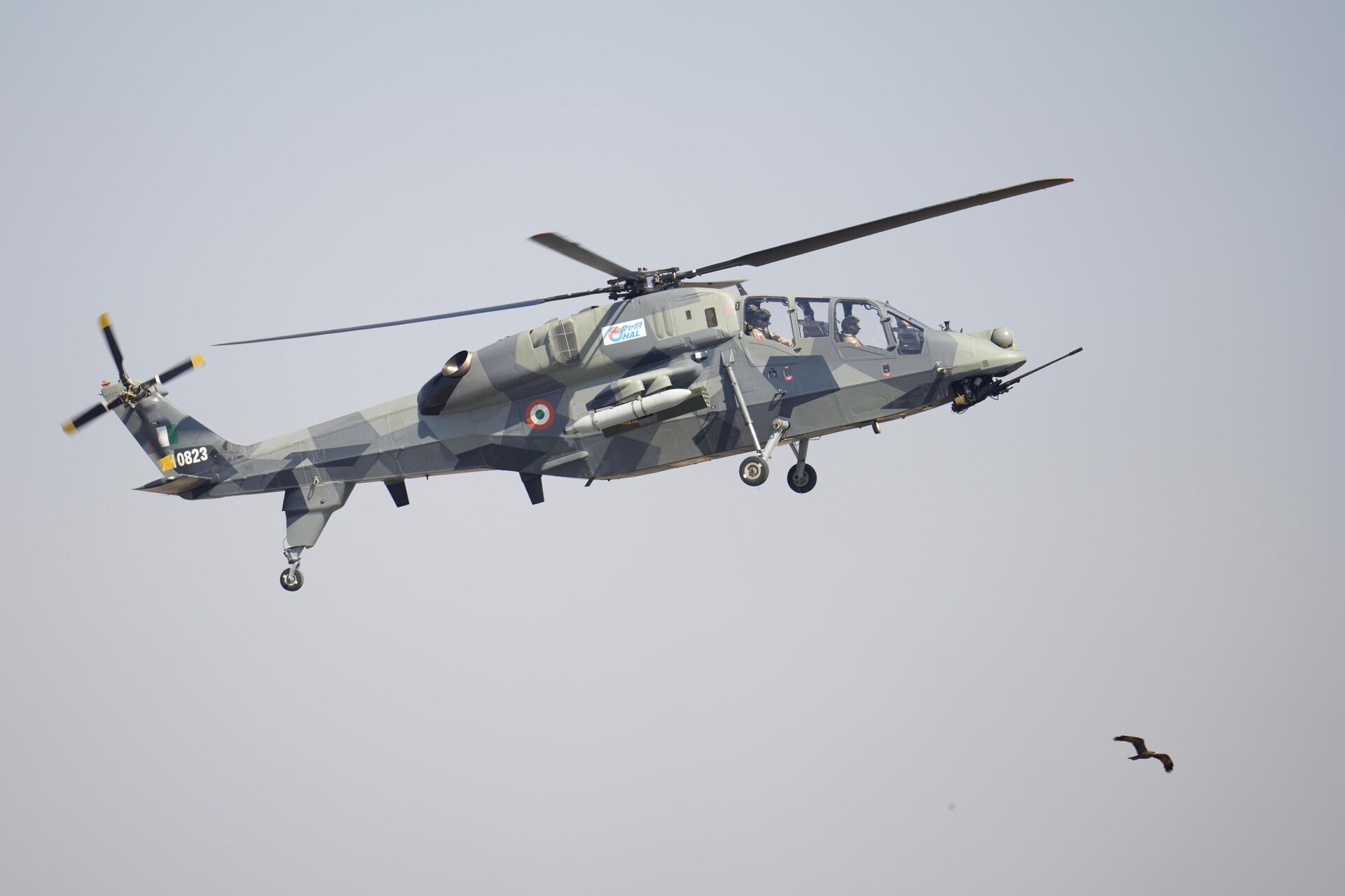 India's indigenous light combat helicopter Prachand flies over a bird during the inauguration of the Aero India 2023 at Yelahanka air base in Bengaluru, India, Monday, Feb. 13, 2023. - Sputnik India, 1920, 04.12.2023