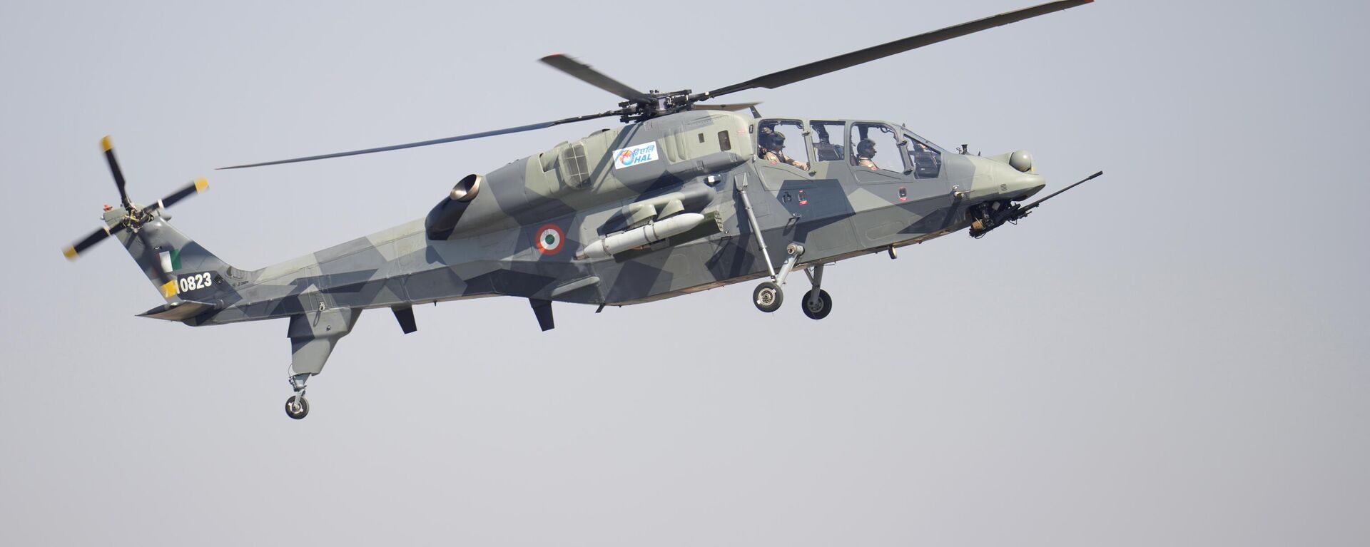 India's indigenous light combat helicopter Prachand flies over a bird during the inauguration of the Aero India 2023 at Yelahanka air base in Bengaluru, India, Monday, Feb. 13, 2023. - Sputnik India, 1920, 02.11.2023