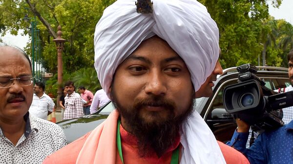 Newly elected member of parliament, Nisith Pramanik, looks on as he arrives to attend the first session of the Indian parliament in New Delhi on June 17, 2019. - Sputnik India
