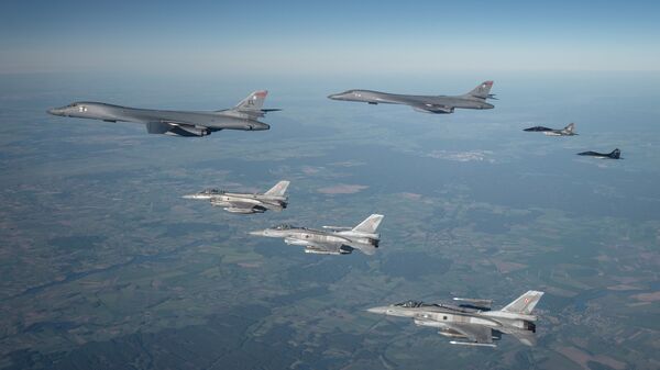 Polish F-16s and MiG-29s escort a B1B Lancer during a training mission for Bomber Task Force Europe, May 29, 2020. - Sputnik भारत