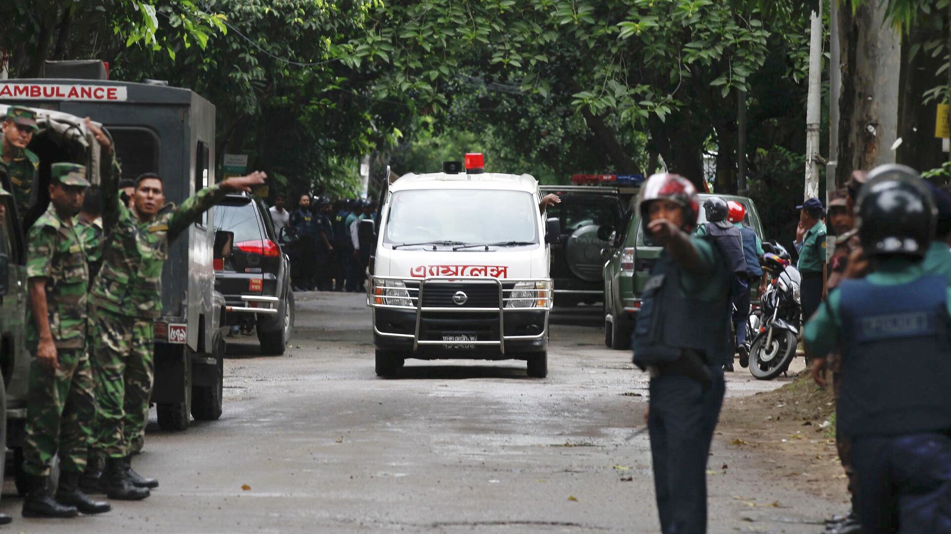 An ambulance transports bodies found at a restaurant popular with foreigners after heavily armed militants attacked it on Friday night in Dhaka, Bangladesh, Saturday, July 2, 2016 - Sputnik India, 1920, 07.03.2023