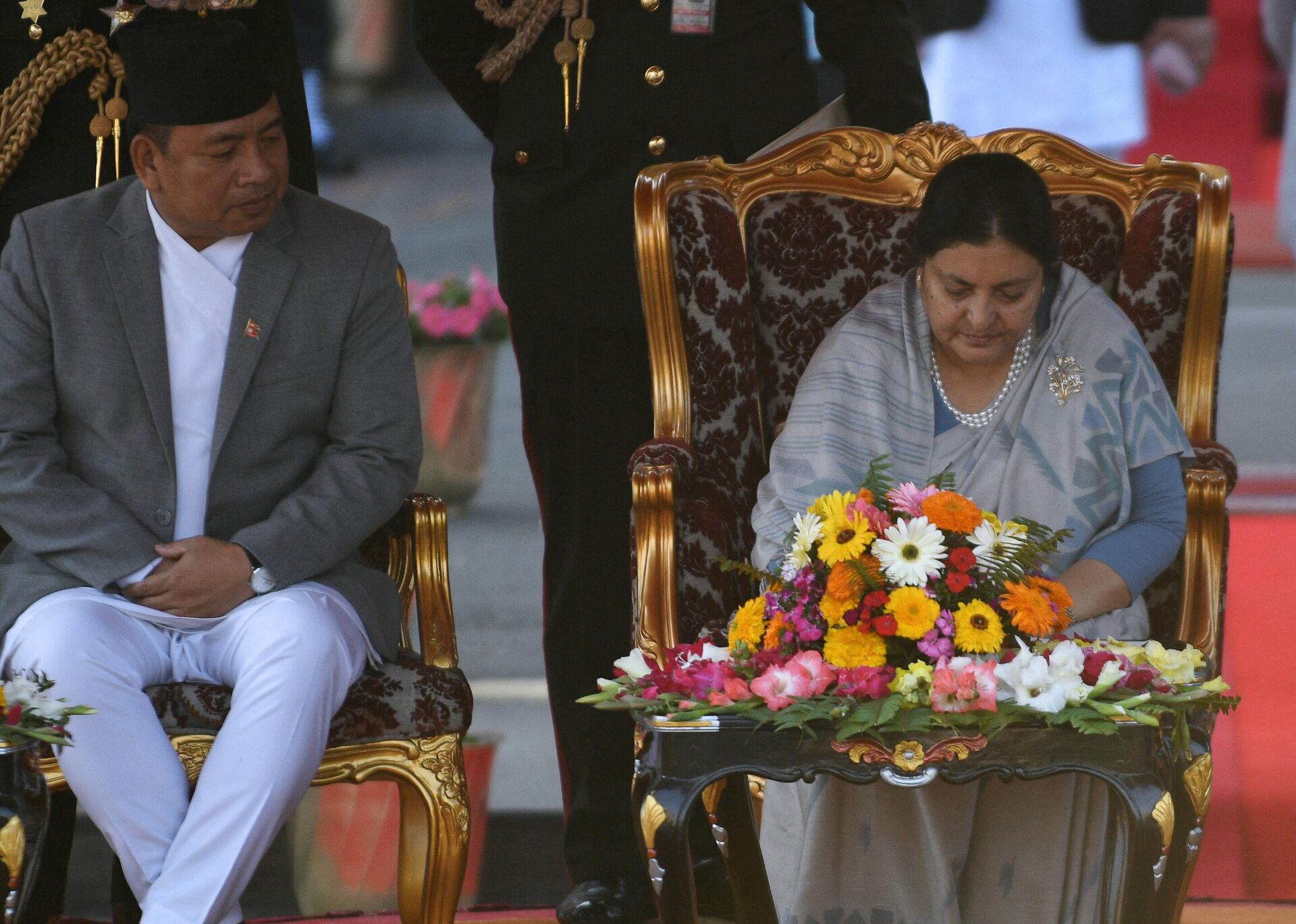 Newly elected Nepali President Bidhya Bhandari (R) signs a document as Vice President Nanda Kishor Pun looks on after the swearing-in ceremony on at the Presidential residence in Kathmandu on March 14, 2018. - Sputnik India, 1920, 10.03.2023