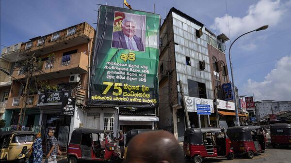 A huge poster with a photograph of President Ranil Wickremesinghe is displayed on the facade of a building  in Colombo, Sri Lanka, Wednesday, March 22, 2023. - Sputnik India