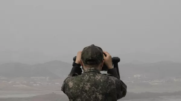 A South Korean army soldier watches the North Korea side from the Unification Observation Post in Paju, South Korea, near the border with North Korea, Friday, March 24, 2023. - Sputnik भारत