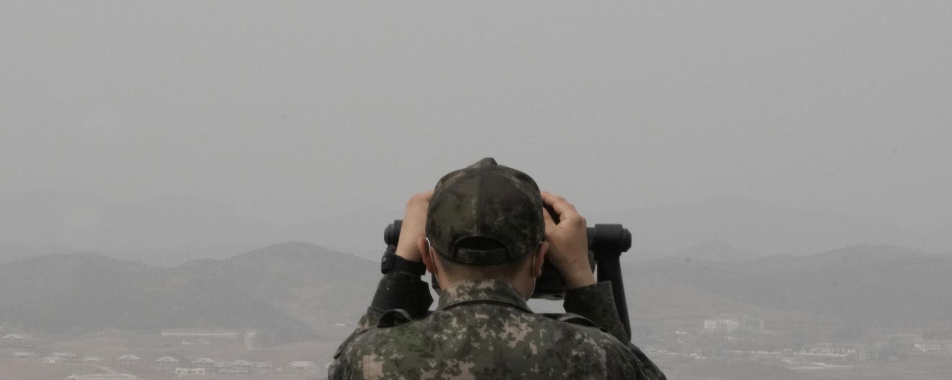 A South Korean army soldier watches the North Korea side from the Unification Observation Post in Paju, South Korea, near the border with North Korea, Friday, March 24, 2023. - Sputnik भारत, 1920, 13.10.2023