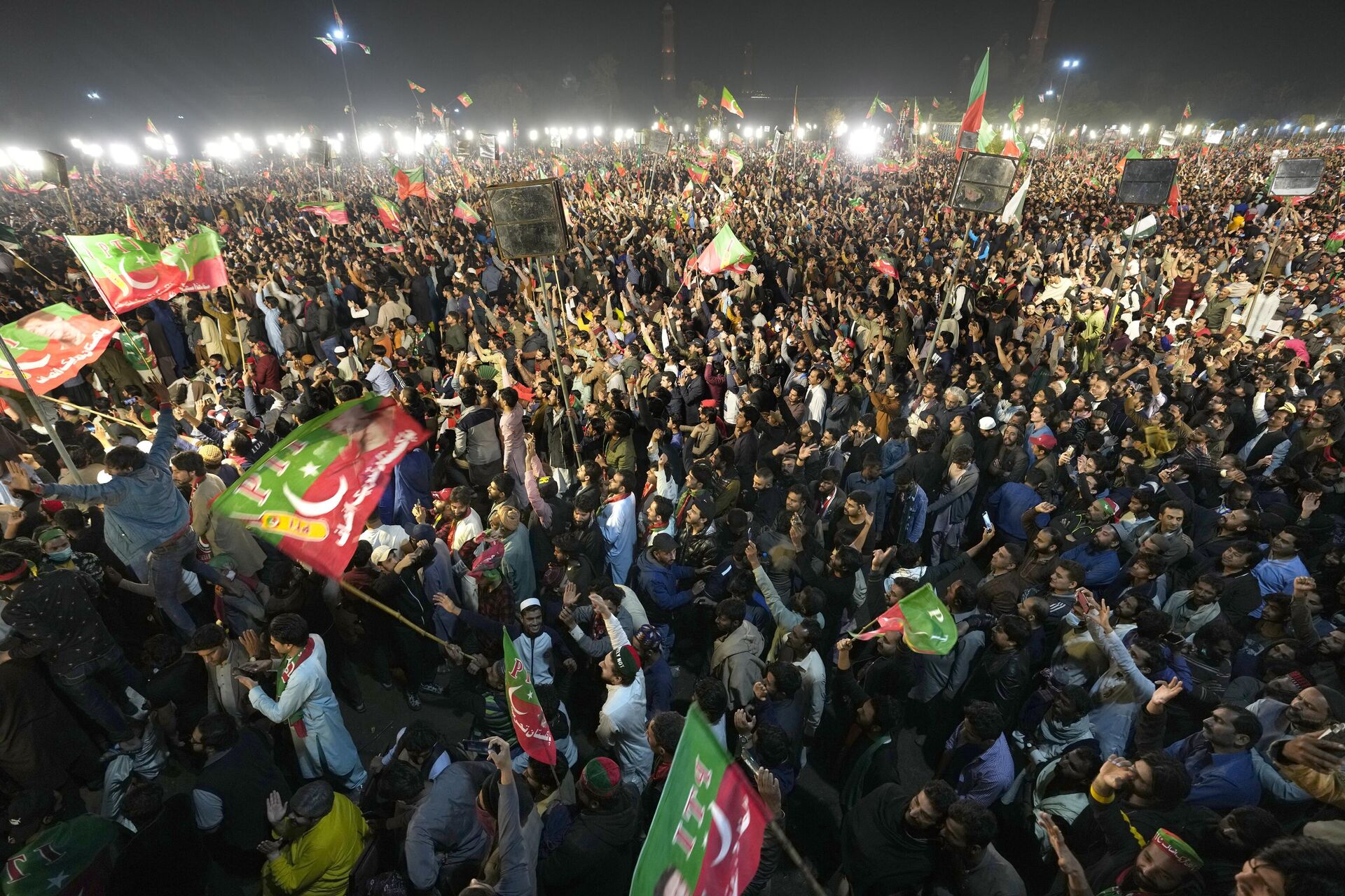Supporters of former Prime Minister Imran Khan listen to his speech during a rally in Lahore, Pakistan, Sunday, March 26, 2023, to pressure the government of Shahbaz Sharif to agree to hold snap elections. - Sputnik India, 1920, 23.01.2024