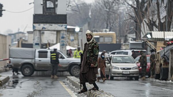 A member of Taliban security force stands guard on a blocked road after a suicide blast near Afghanistan's foreign ministry at the Zanbaq Square in Kabul on January 11, 2023. - Sputnik India