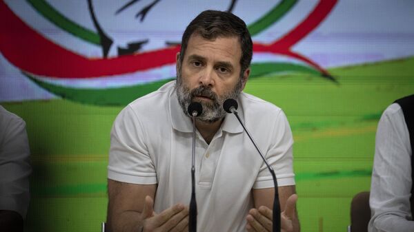 Indian opposition leader Rahul Gandhi addresses a press conference after he was expelled from parliament Friday, a day after a court convicted him of defamation and sentenced him to two years in prison for mocking the surname Modi in an election speech, in New Delhi, India, Saturday, March 25, 2023. - Sputnik भारत
