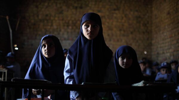 In this photo taken on Tuesday, Oct. 13, 2009, children attend a class in a school in Qutbal, Pakistan. - Sputnik India